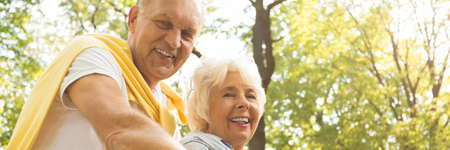 Happy senior couple spending time in a park