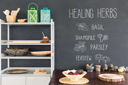 Shelf and wooden table with healing herbsの写真素材