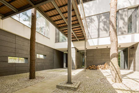 Spacious patio in modern house with the ground lined with small pebbles