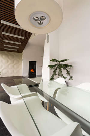 Modernly designed home area with dining table and chairs