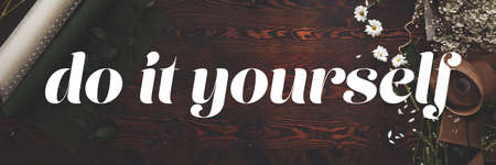 Big white inspirational text in the photo of florist's deskの写真素材