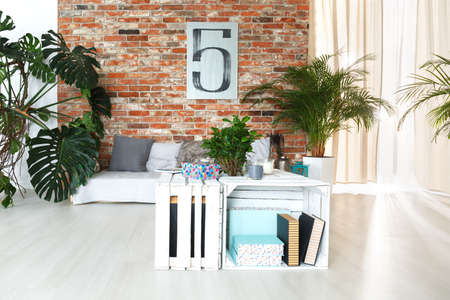 Modern loft with shelves made of white wooden boxesの写真素材