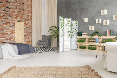 Spacious cozy bedroom connected with white loungeの写真素材