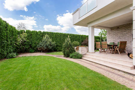 Modern house with beauty garden and terrace