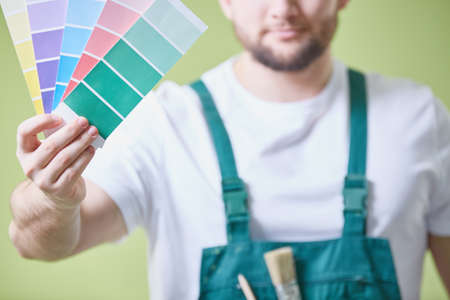 Painter is choosing the colour of the paint