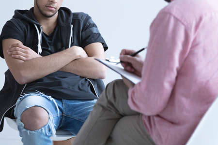 Troubled teenager during meeting with his psychologist