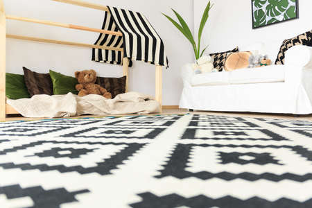 Monochrome minimalist carpet in modern kids playroomの写真素材