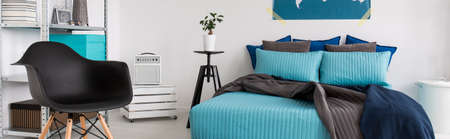 Panoramic view of modern bedroom in blue and gray colorの写真素材