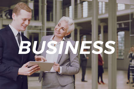 Young businessman and professional businesswoman in corporation