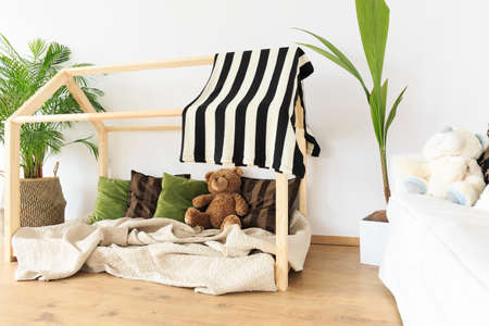 Botanical eco friendly decor in natural minimalist kids roomの写真素材