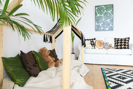 Botanical calm bright kids interior with tropical printsの写真素材