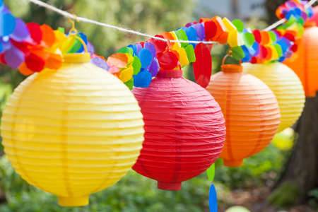 Close-up of colorful chinese lantern hang in the gardenの写真素材