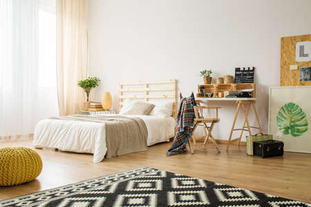 Spacious modern bedroom decorated with diy accessoriesの写真素材