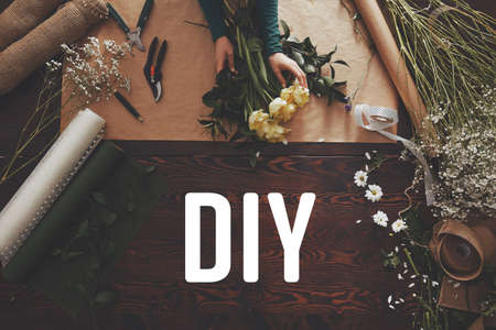 Top view of creative woman designing floral arrangementの写真素材