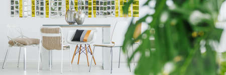 Room with communal table and modern chairsの写真素材