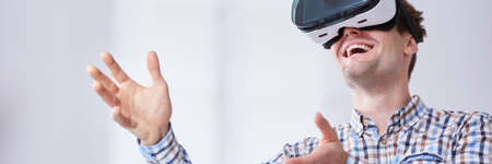 Young, handsome man inside virtual realityの写真素材
