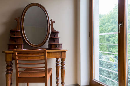 Private elegant room with old dressing table and windowの写真素材