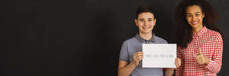 Young teacher and multilingual boy studying foreign languagesの写真素材