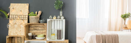 Black and white multifunctional apartment with pallet bookcase, panoramaの写真素材