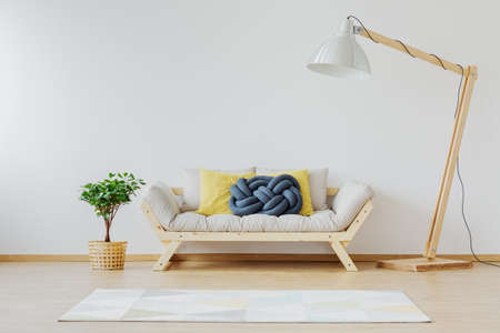 Designer, wooden furniture in bright, spacious roomの写真素材