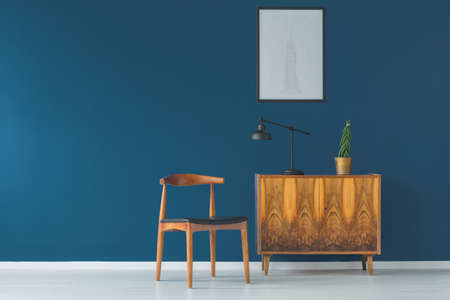 Intensive blue wall and vintage designer chairの写真素材