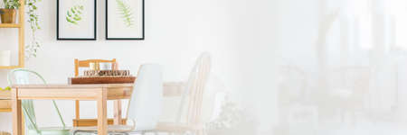 Wooden and white design of spacious dining roomの写真素材