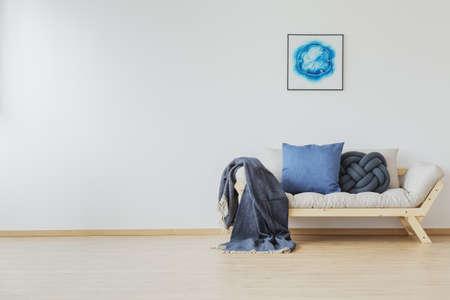 Blue decoration accents in home with designer sofa