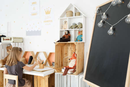 Clean fresh girl's room in nordic style with handmade deskの写真素材