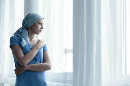 Woman with cancer  disease alone in hospitalの写真素材