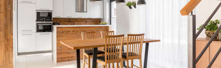 Spacious modern designed wooden kitchen with dining spaceの写真素材