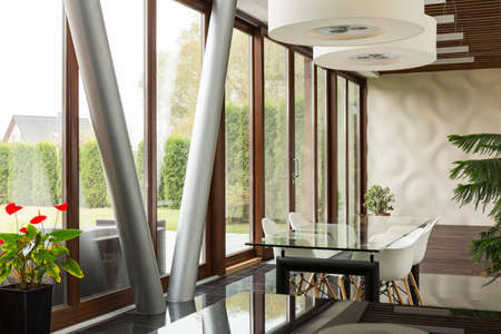 Big windows on the wall in modern designed dining hall