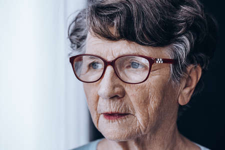 Sad older lady worrying her memory problemsの写真素材