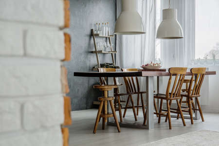 Bricks and concrete in modern dining roomの写真素材