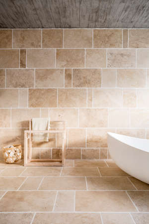 Minimalistic vertical view of bathroom covered in sunlightの写真素材