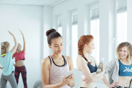 Girls in good shape training on a gym