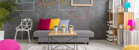 Creative living room decor with decorative tape on wallsの写真素材