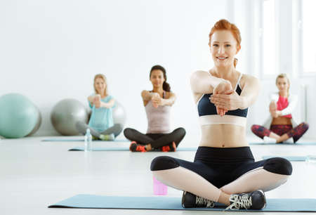 Young sportive women having fitness classes