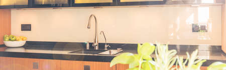 Bright open plan kitchen interior with marble worktop