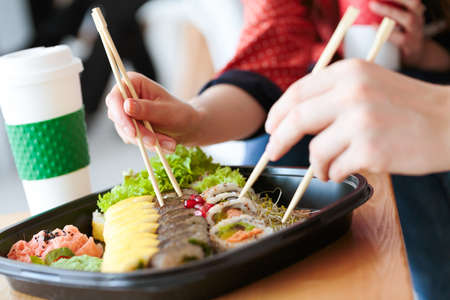 Lunch break at work with healthy oriental food