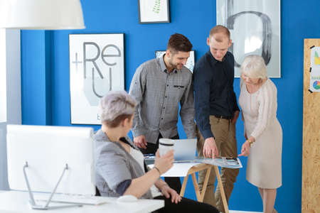 Group of employees in training having a meeting with their supervisorの写真素材