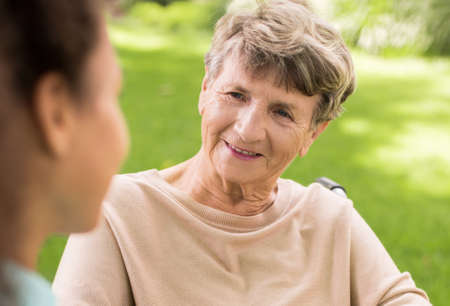 Senior happy woman relaxing in the gardenの写真素材