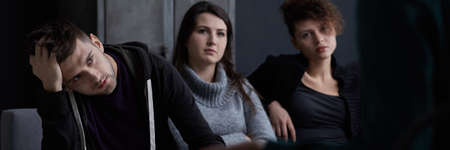 Group therapist talking with patients of alcohol rehab treatmentの写真素材