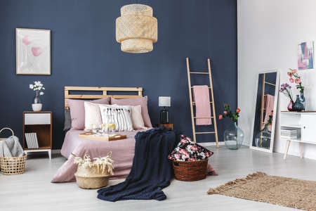 Stylish modern apartment with cute decorations and rug on the floorの写真素材