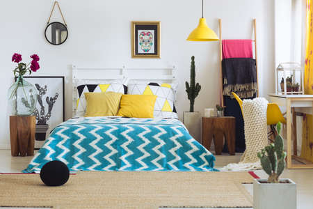 Trendy geometric decor in bright colorful bedroom with vivid colorsの写真素材