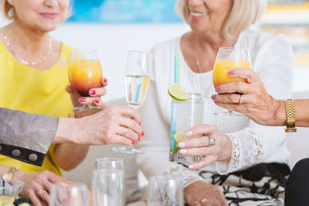 Close-up of colorful drinks and glass of champagneの写真素材