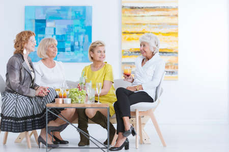 Group of happy artists celebrating together after successful openingの写真素材