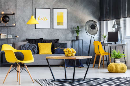 Fresh and playful apartment interior with pop of lemon yellow colorの写真素材