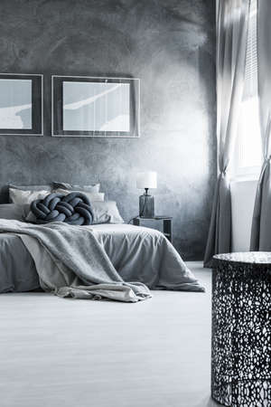Bright and spacious master bedroom with neutral gray interior designの写真素材