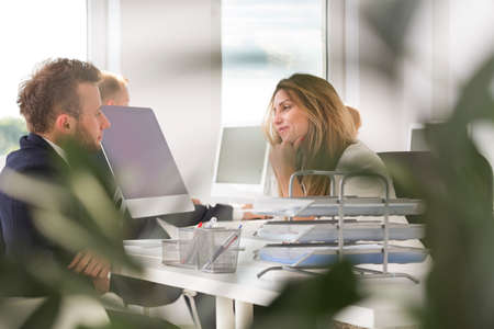 Blond and beautiful woman seduces her boss at work