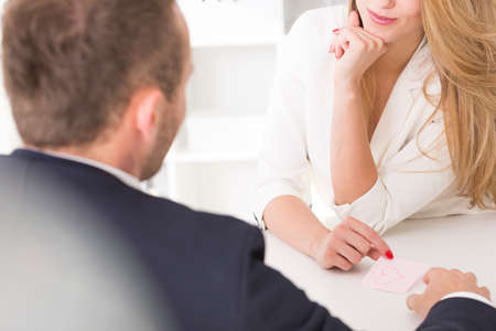 Blond and beautiful woman seducing her male bossの写真素材